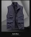 Détail de la veste utilitaire bleu foncé avec plusieurs poches et un col montant chic - M / Bleu foncé