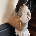 Vintage brown leather Boston bag with a round logo and colorful beaded pendant charm - Yellow Brown