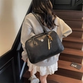 Retro black leather tote bag with silver logo and colorful beaded tassel charm - Black