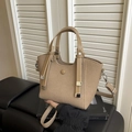 Light brown woven bucket bag with leather top handle and shoulder strap - Khaki