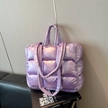 Light purple quilted puffer tote bag with padded handles and spacious interior design - Purple