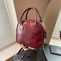 Fashionable burgundy leather patchwork crossbody bag with elegant top handles and strap - Burgundy