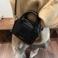 Retro black leather Boston handbag for women with checkered texture and crossbody strap - Black