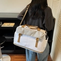 Large white canvas travel bag with khaki straps and GUOMTSS lettering logo - Off-white