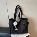 Large capacity black nylon tote bag with exterior pockets and cute monster pendant - Black with Pendant