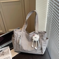 Large taupe nylon tote bag with plush pendant and side pocket for daily commute - Gray With Pendant