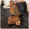 Macro detail of brown suede Boston bag featuring chocolate donut plush and wooden beads - With Charm / Brown