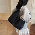 Minimalist black large capacity crossbody tote bag with silver zipper in waterproof nylon - Black