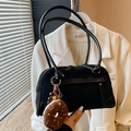 Retro black suede and leather shoulder bag with cute donut plush charm on wood table - With Charm / Black