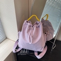 Chic light purple nylon drawstring backpack with vibrant yellow woven handles for women - Purple