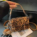 Leopard print woven crossbody bag with chain strap and plush bow accessory - Brown Leopard with Pendant