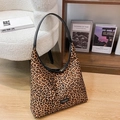 Mini leopard print crossbody bag with black leather shoulder strap and fashion label - Yellow Leopard