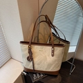 Large beige tote bag with dark brown leather straps and metal pendant accent - White Brown With Charm