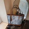 Minimalist denim blue tote bag with brown leather trim and golden metal logo plate - Blue with Charm