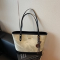 Light gray rock texture tote bag with black shoulder straps and gold metal detail - White and Black Patchwork With Charm