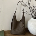 Large dark coffee suede tote bag with small coin purse on a wooden bench - Olive Green