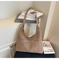 Detail shot of apricot hollow tote bag featuring laser-cut geometric patterns and texture - Brown