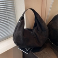 Large black frosted leather hobo bag with wide shoulder strap and minimalist half-moon shape - Black