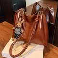 Dark brown leather tote bag with glossy finish and cute plush rabbit charm - Brown