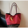 Macro shot of dark red suede tote bag with decorative colorful beaded leopard charm - Wine Red With Pendant