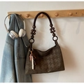 Detail of quilted coffee suede shoulder bag with retro wooden beads and woven strap - Green