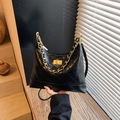 Elegant black quilted hobo bag with gold chain handle and vintage turn-lock closure - Black