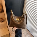 Dark brown quilted hobo bag in glossy leather with gold chain and turn-lock closure - Brown