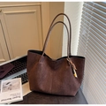 Close-up of deep brown suede tote bag featuring a vintage wooden bead tassel detail - Coffee with Pendant