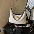 Quilted leather shoulder bag in beige and black with gold chain and twist lock - White