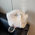 White faux shearling crossbody bag with adjustable strap on a minimalist setting - Off-white