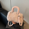 Pink faux shearling crossbody bag with soft plush texture and adjustable leather strap - Pink