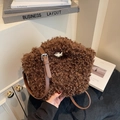 Deep brown faux fur crossbody bag with adjustable leather strap and silver buckle detail - Coffee