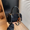 Retro matte black suede crossbody pillow bag with wooden bead tassel and gold hardware - Black