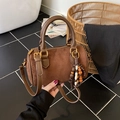 Vintage brown frosted suede cylinder bag with elegant wooden bead charm and gold hardware - Brown