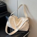 Creamy white oversized tote bag with adjustable wide strap and smooth faux leather finish - Off White