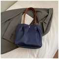 Dark blue nylon tote bag with brown leather handles and gold metal clasp closure - Small / Blue