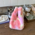 Detail of pink and white plush bucket bag with soft texture and golden metal chain strap - Pink