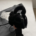 Chic black plush faux fur crossbody bucket bag with modular spherical texture and top handle - Black