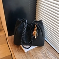 Large black suede tote bag with woven handles and decorative wooden bead charm - Black