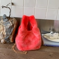 Furry pink plush bucket bag featuring a gold metal chain strap and top handle design - Red