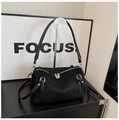Detailed close-up of a black matte suede Boston bag with double zippers and silver hardware - Black