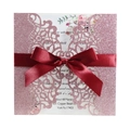 Pink laser cut wedding invitation with glitter finish and burgundy silk ribbon bow - Pink
