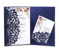Detail showing navy blue laser-cut wedding invitation shell with floral RSVP cards - Magic Blue