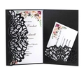 Detail of laser-cut hollow black wedding invitation with pink floral inner card - Black