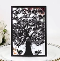 Detail of laser-cut black card featuring intricate tree, owl and butterfly patterns - Black