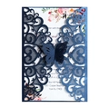 Elegant laser-cut navy blue wedding invitation card with lace patterns and white floral insert - Magic Blue