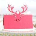 Laser-cut red reindeer place card with pearl finish on festive dining table setting - Pearlescent Red