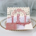 Detail of pink glitter laser cut wedding invitation with 3D couple and floral patterns - Glitter Pink