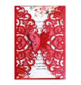 Detail of red laser-cut wedding invitation with hollow heart patterns and 3D butterfly decor - Pearlescent Red