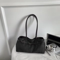 Black vintage suede tote bag with shoulder straps and metal buckle on a desk - Black without Pendant